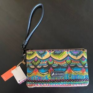 Sakroots wristlet w/charger—NEW and never used, w/internal battery and cord.